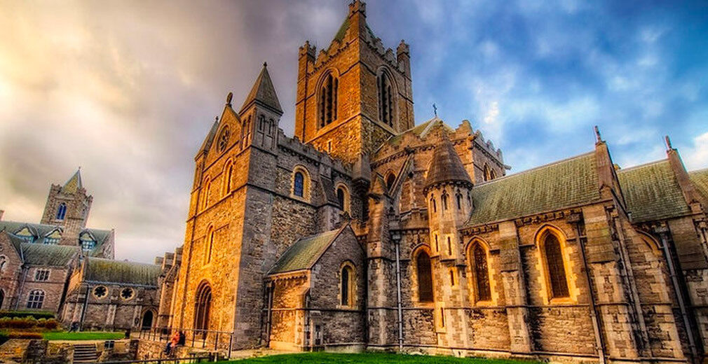 Exterior of Christ Church Cathedral Dublin at sunset with dramatic sky