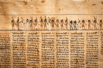 Ancient Egyptian papyrus scroll with hieroglyphics and illustrations.