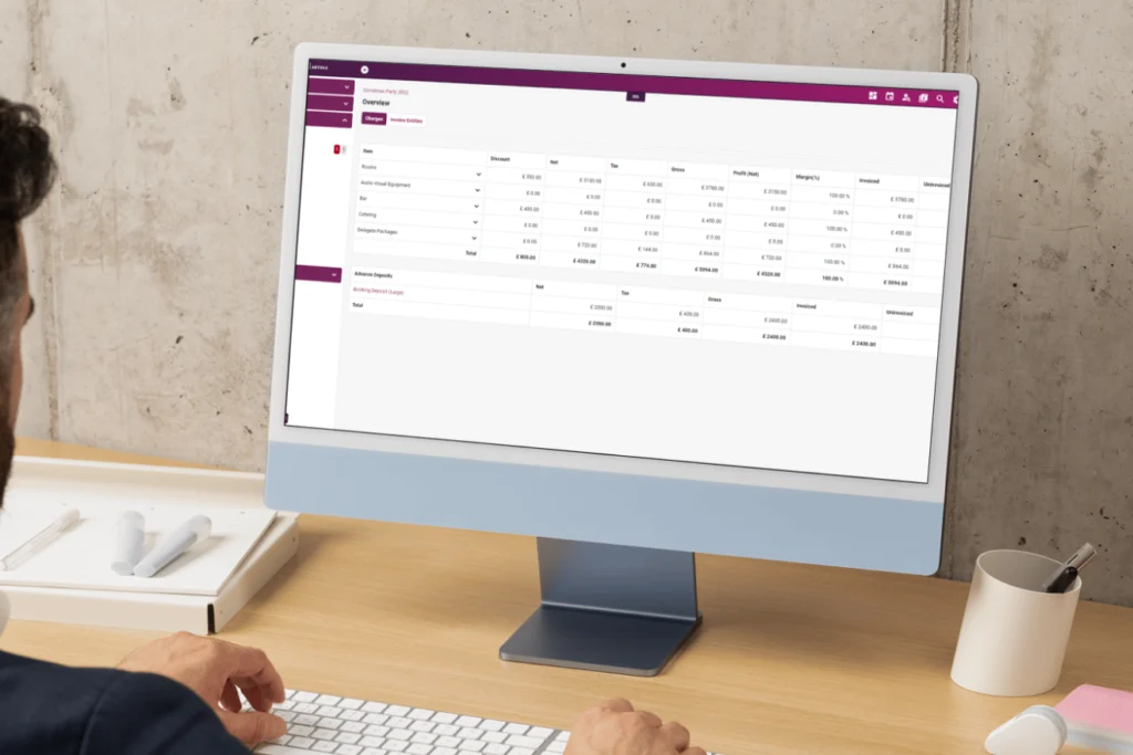 User reviewing financial breakdown and invoicing data in Artifax on a desktop screen.