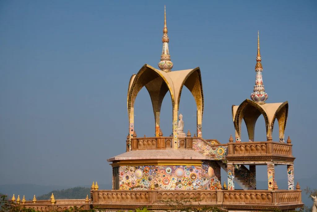 Intricately designed Buddhist temple with colorful mosaic decorations.