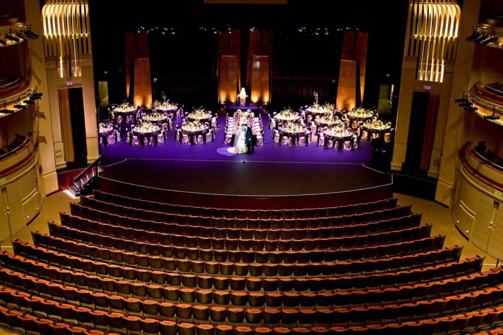Banquet-style event setup on stage inside the California Center for the Arts Escondido theatre