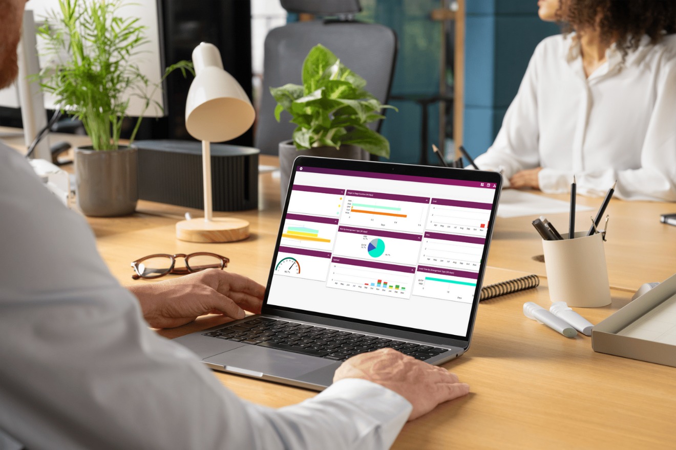 Person using a laptop displaying Artifax dashboard analytics and charts.