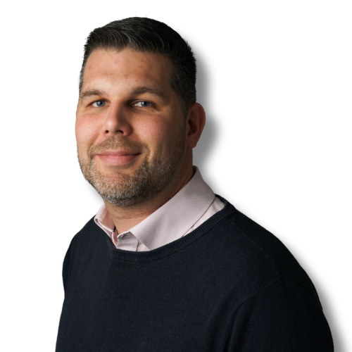 Man with short hair and beard in a navy sweater